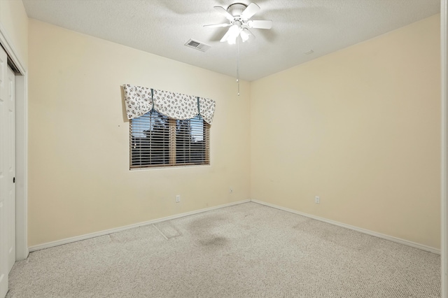 736 Gray Hawk Dr NE, Rio Rancho, NM 87144 - unfurnished bedroom featuring carpet floors, a closet, a textured ceiling, and ceiling fan