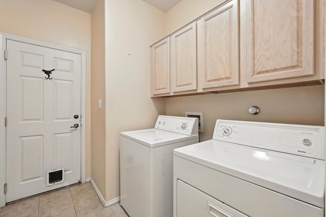 736 Gray Hawk Dr NE, Rio Rancho, NM 87144 - washroom featuring washing machine and dryer, cabinet space, and light tile patterned flooring