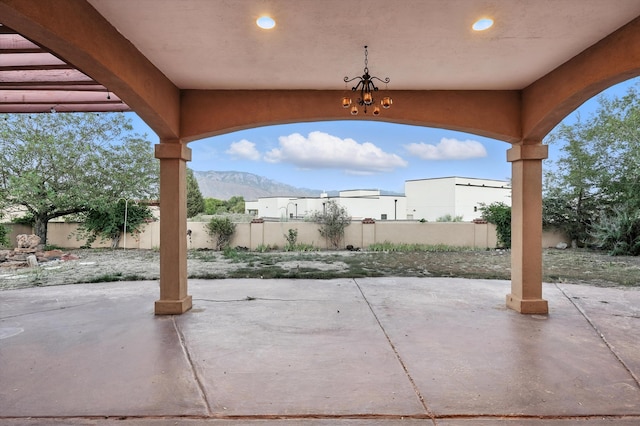 736 Gray Hawk Dr NE, Rio Rancho, NM 87144 - fenced backyard featuring a patio and a mountain view
