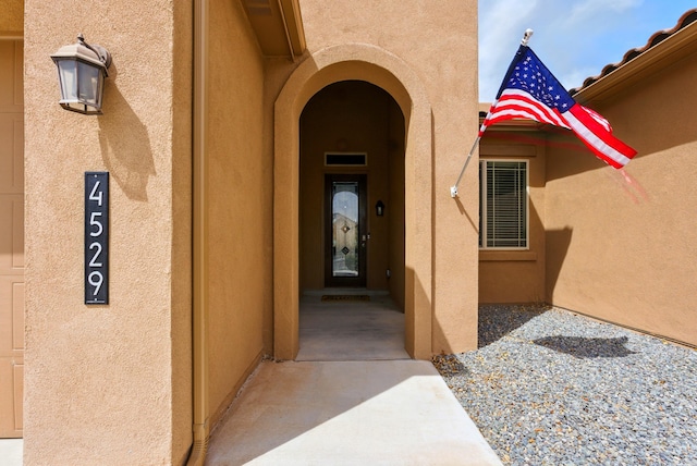 4529 Skyline Loop NE, Rio Rancho, NM 87144 - doorway to property with stucco siding