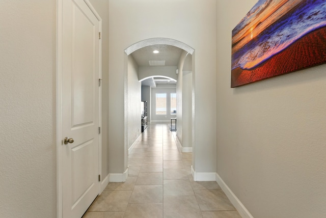 4529 Skyline Loop NE, Rio Rancho, NM 87144 - corridor featuring arched walkways and light tile patterned floors