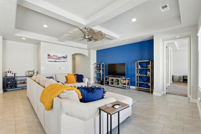 4529 Skyline Loop NE, Rio Rancho, NM 87144 - living room featuring arched walkways, beam ceiling, recessed lighting, light tile patterned floors, and a ceiling fan