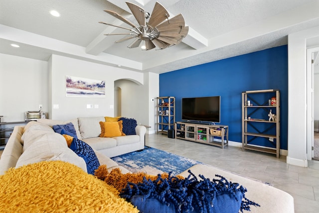 4529 Skyline Loop NE, Rio Rancho, NM 87144 - tiled living area with arched walkways, a ceiling fan, a textured ceiling, recessed lighting, and beamed ceiling