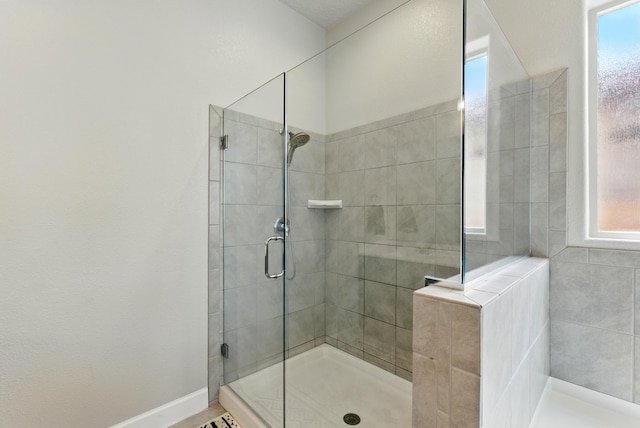 4529 Skyline Loop NE, Rio Rancho, NM 87144 - full bathroom featuring a tile shower and baseboards