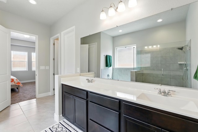 4529 Skyline Loop NE, Rio Rancho, NM 87144 - bathroom with double vanity, a shower stall, tile patterned flooring, recessed lighting, and connected bathroom