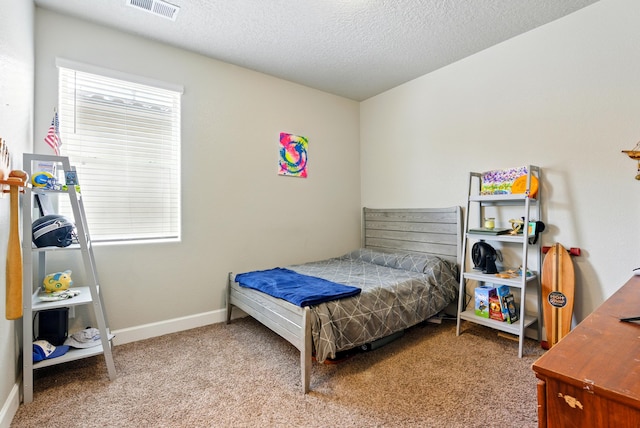 4529 Skyline Loop NE, Rio Rancho, NM 87144 - carpeted bedroom featuring a textured ceiling and baseboards