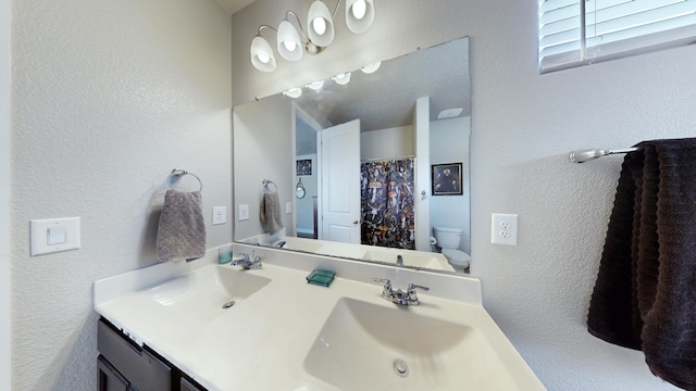 4529 Skyline Loop NE, Rio Rancho, NM 87144 - bathroom with double vanity and a textured wall
