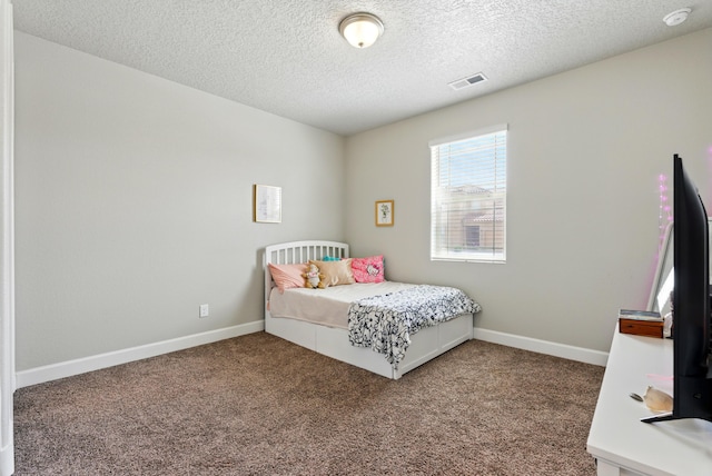 4529 Skyline Loop NE, Rio Rancho, NM 87144 - carpeted bedroom with a textured ceiling and baseboards