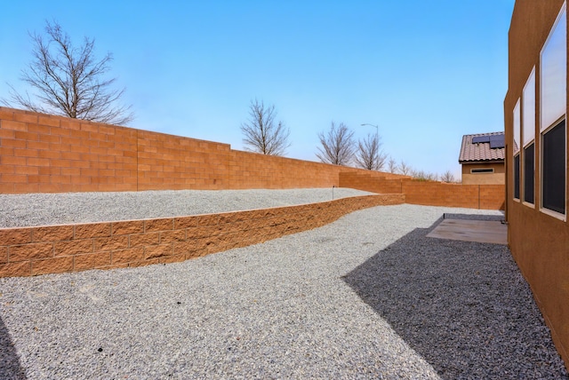 4529 Skyline Loop NE, Rio Rancho, NM 87144 - fenced backyard with a patio