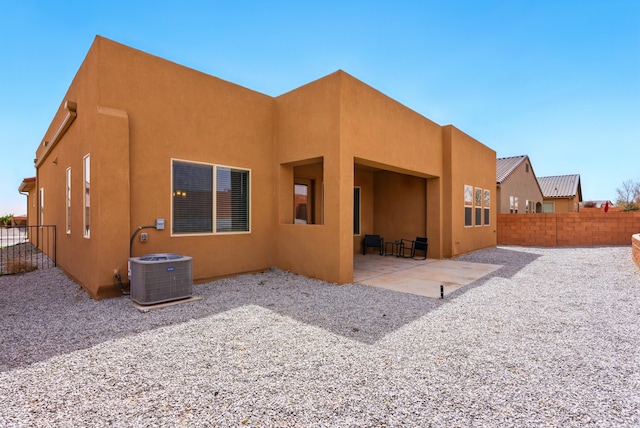 4529 Skyline Loop NE, Rio Rancho, NM 87144 - rear view of house featuring stucco siding and a patio area