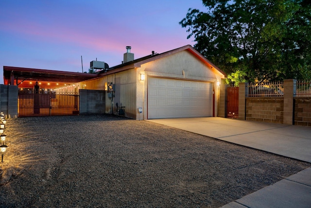 9616 Eucariz Ave SW, Albuquerque, NM 87121 - garage with a gate and concrete driveway