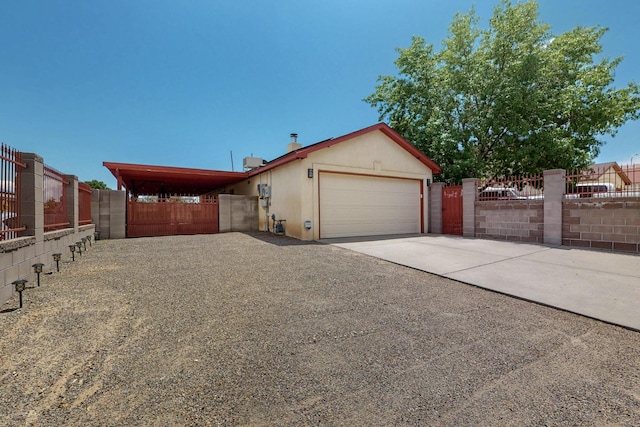 9616 Eucariz Ave SW, Albuquerque, NM 87121 - view of front of property featuring concrete driveway and a garage