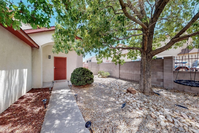 9616 Eucariz Ave SW, Albuquerque, NM 87121 - property entrance with stucco siding