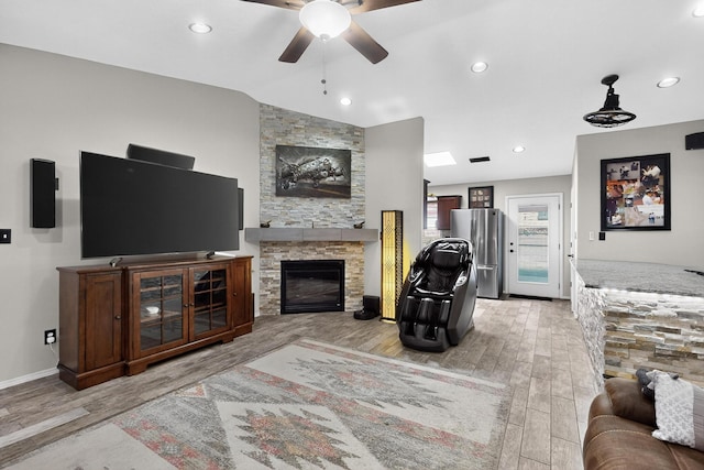9616 Eucariz Ave SW, Albuquerque, NM 87121 - living area with ceiling fan, light wood-style floors, a fireplace, and recessed lighting