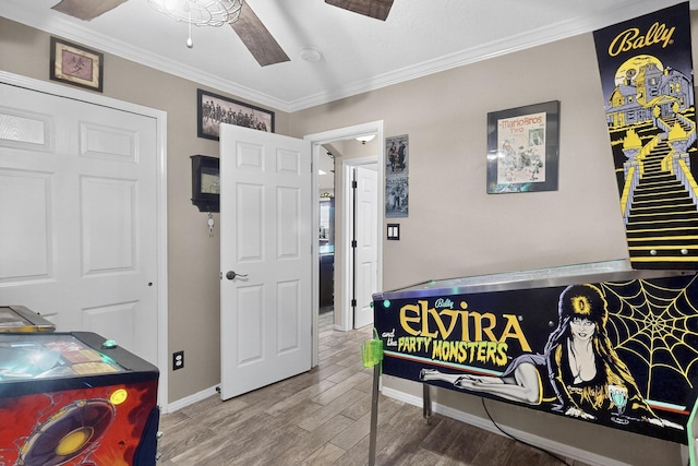 9616 Eucariz Ave SW, Albuquerque, NM 87121 - game room with wood finished floors, ornamental molding, and ceiling fan
