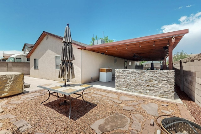9616 Eucariz Ave SW, Albuquerque, NM 87121 - back of property featuring a patio area, a fenced backyard, and a ceiling fan