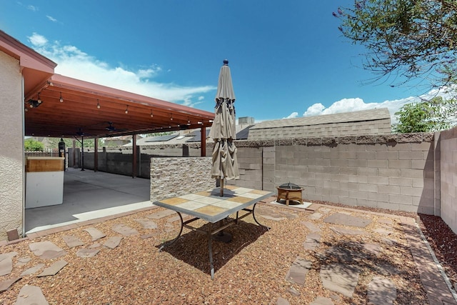 9616 Eucariz Ave SW, Albuquerque, NM 87121 - fenced backyard featuring a patio area and ceiling fan