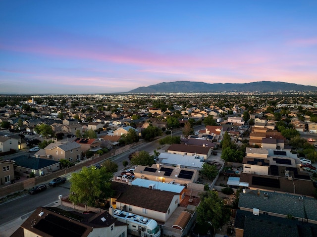 9616 Eucariz Ave SW, Albuquerque, NM 87121 - aerial view at dusk of a mountain view and a residential view