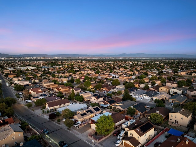 9616 Eucariz Ave SW, Albuquerque, NM 87121 - aerial view at dusk of a mountain view and a residential view