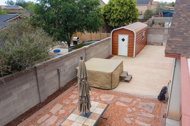 9616 Eucariz Ave SW, Albuquerque, NM 87121 - fenced backyard featuring a patio area, a shed, and grilling area
