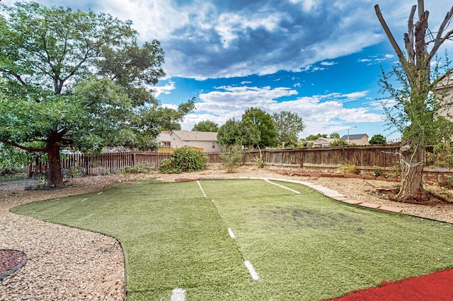 701 Autumn Meadows Dr, Rio Rancho, NM 87144 - fenced backyard with an area to practice putting