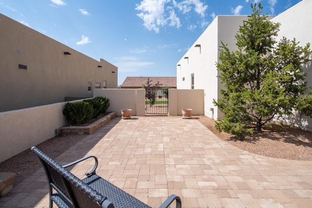 1978 Castle Peak Loop NE, Rio Rancho, NM 87144 - view of patio featuring a gate