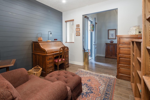 1978 Castle Peak Loop NE, Rio Rancho, NM 87144 - office with wood walls, wood finished floors, and a textured ceiling