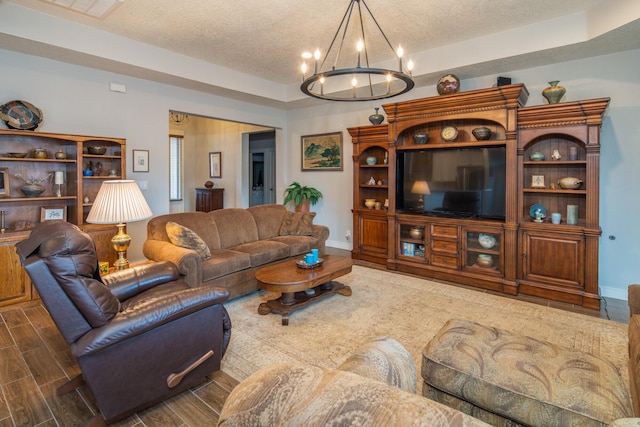 1978 Castle Peak Loop NE, Rio Rancho, NM 87144 - living room featuring a textured ceiling, a chandelier, and wood finished floors