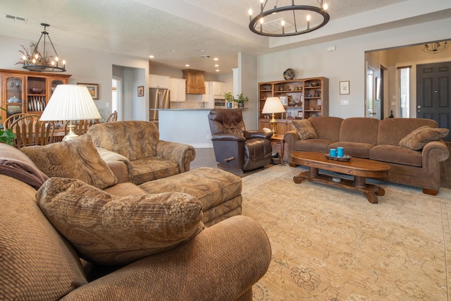 1978 Castle Peak Loop NE, Rio Rancho, NM 87144 - living area with a chandelier, recessed lighting, and a textured ceiling
