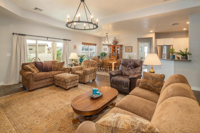 1978 Castle Peak Loop NE, Rio Rancho, NM 87144 - living room featuring a chandelier, wood finished floors, and recessed lighting