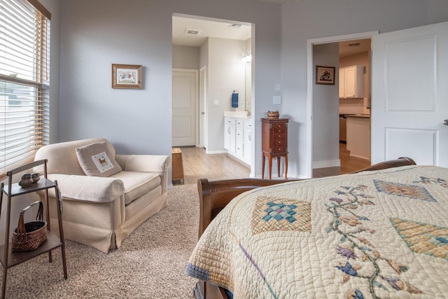 1978 Castle Peak Loop NE, Rio Rancho, NM 87144 - bedroom with wood finished floors and ensuite bath
