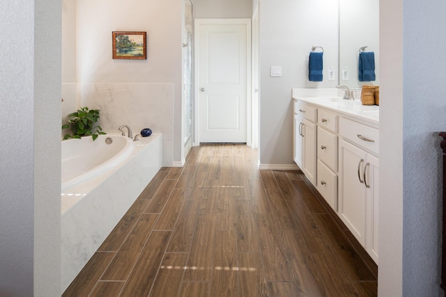 1978 Castle Peak Loop NE, Rio Rancho, NM 87144 - full bathroom featuring wood finished floors, vanity, a bath, and walk in shower