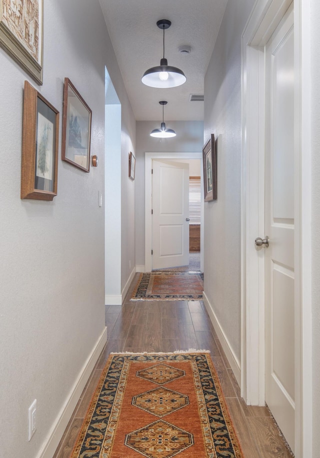 1978 Castle Peak Loop NE, Rio Rancho, NM 87144 - hallway with wood finished floors and baseboards
