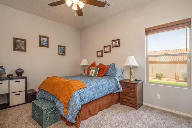 1978 Castle Peak Loop NE, Rio Rancho, NM 87144 - carpeted bedroom featuring a textured ceiling and ceiling fan