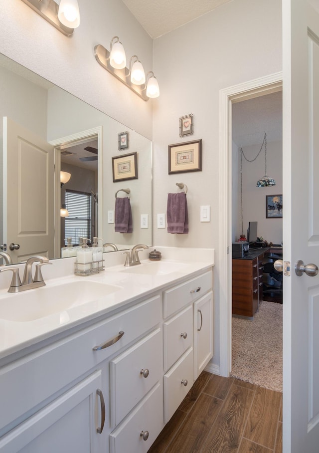 1978 Castle Peak Loop NE, Rio Rancho, NM 87144 - bathroom with wood finished floors and double vanity