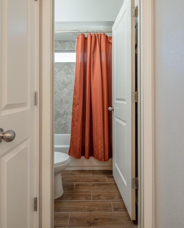 1978 Castle Peak Loop NE, Rio Rancho, NM 87144 - bathroom featuring wood finish floors and shower / tub combo with curtain