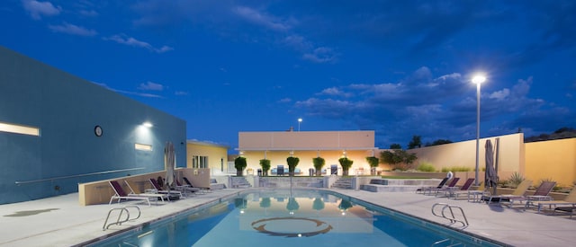 1978 Castle Peak Loop NE, Rio Rancho, NM 87144 - pool at night with a patio area and a community pool