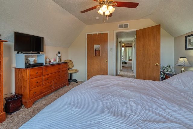 1 Dinosaur Rd, Stanley, NM 87056 - bedroom featuring carpet flooring, lofted ceiling, a textured ceiling, and a ceiling fan