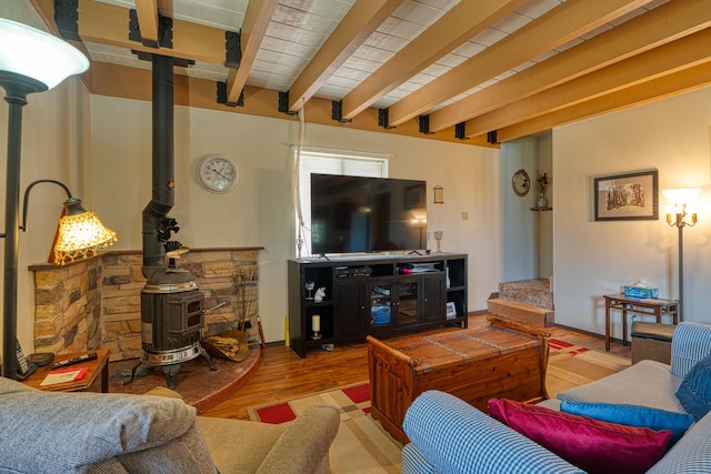 1 Dinosaur Rd, Stanley, NM 87056 - living room with a wood stove, wood finished floors, and beamed ceiling