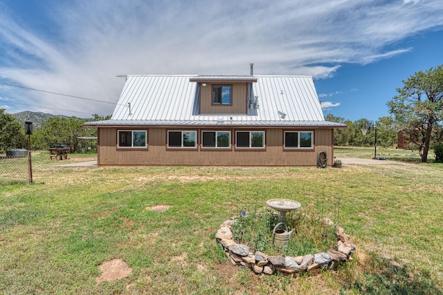 1 Dinosaur Rd, Stanley, NM 87056 - back of property featuring a lawn and a metal roof