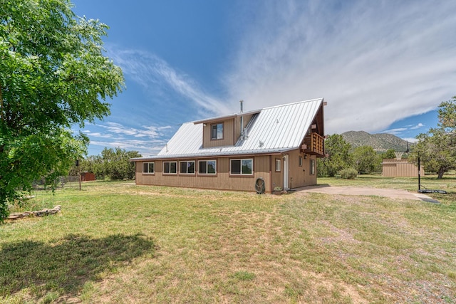 1 Dinosaur Rd, Stanley, NM 87056 - back of house featuring a metal roof and a mountain view