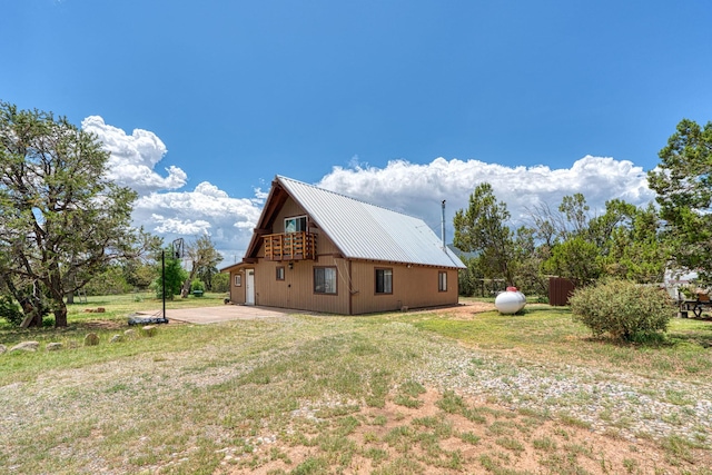 1 Dinosaur Rd, Stanley, NM 87056 - view of home's exterior featuring a metal roof and a yard