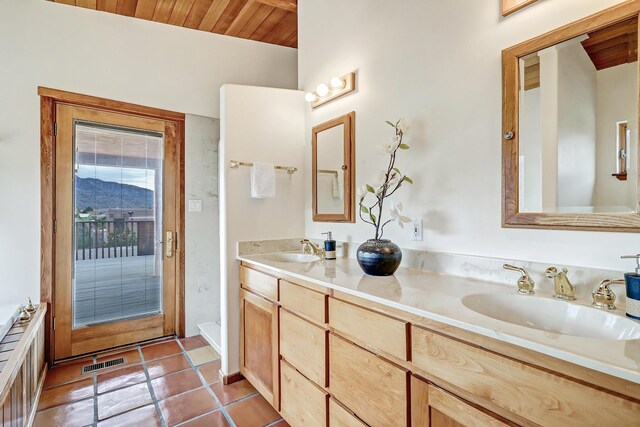1036 Red Oaks Loop NE, Albuquerque, NM 87122 - bathroom featuring double vanity, wooden ceiling, and tile patterned flooring