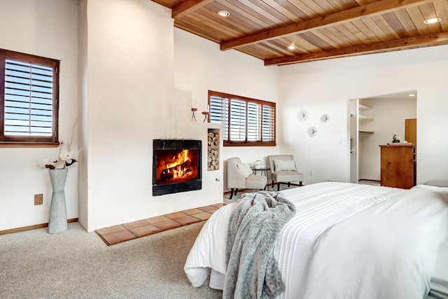 1036 Red Oaks Loop NE, Albuquerque, NM 87122 - bedroom with a warm lit fireplace, a wood ceiling with exposed beams, carpet flooring, and recessed lighting