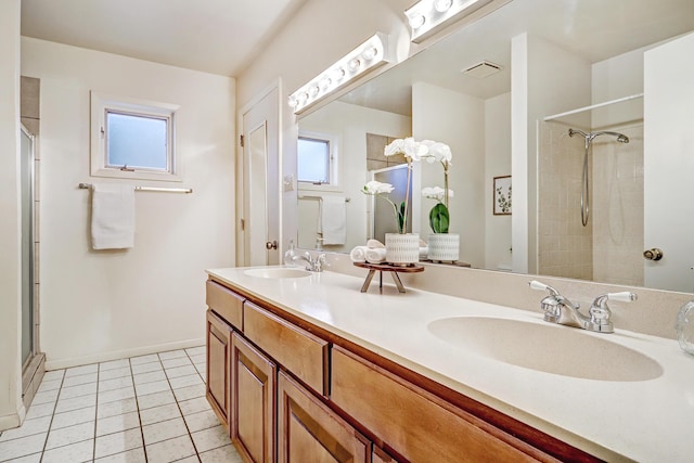 1036 Red Oaks Loop NE, Albuquerque, NM 87122 - full bath featuring healthy amount of natural light, a shower with door, double vanity, and tile patterned flooring