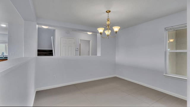 3536 Clear Creek Pl, Rio Rancho, NM 87144 - spare room featuring a chandelier and tile patterned flooring