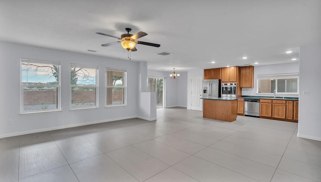 3536 Clear Creek Pl, Rio Rancho, NM 87144 - kitchen featuring appliances with stainless steel finishes, open floor plan, a chandelier, ceiling fan, and recessed lighting