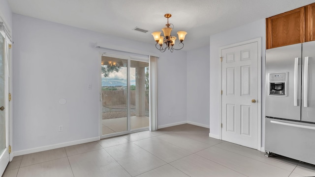 3536 Clear Creek Pl, Rio Rancho, NM 87144 - unfurnished dining area featuring a chandelier and light tile patterned flooring