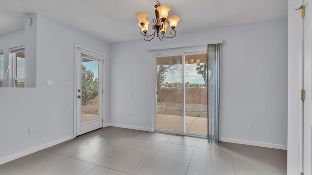 3536 Clear Creek Pl, Rio Rancho, NM 87144 - unfurnished dining area with a chandelier, plenty of natural light, and tile patterned flooring