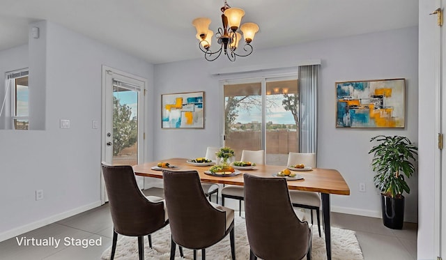 3536 Clear Creek Pl, Rio Rancho, NM 87144 - tiled dining space featuring a chandelier and baseboards
